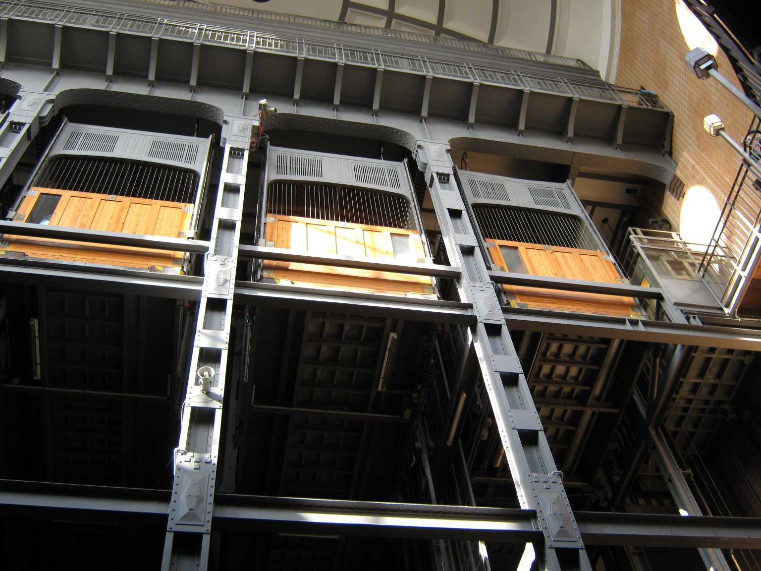 Four large lifts transport cyclists and motor vehicles to and from the surface